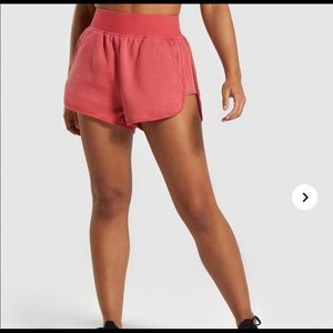 Gymshark legacy shorts. size small color brick red
